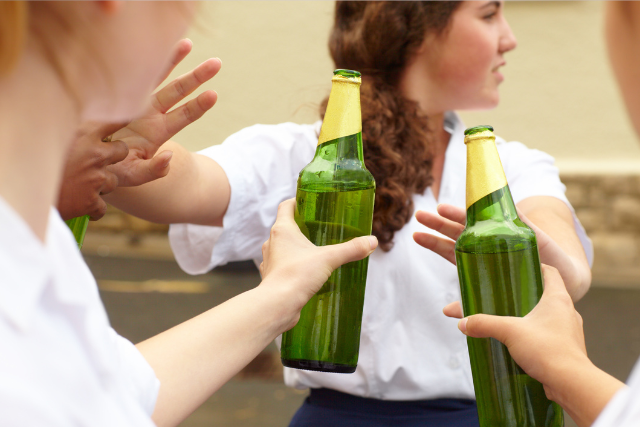 young students offering alcohol